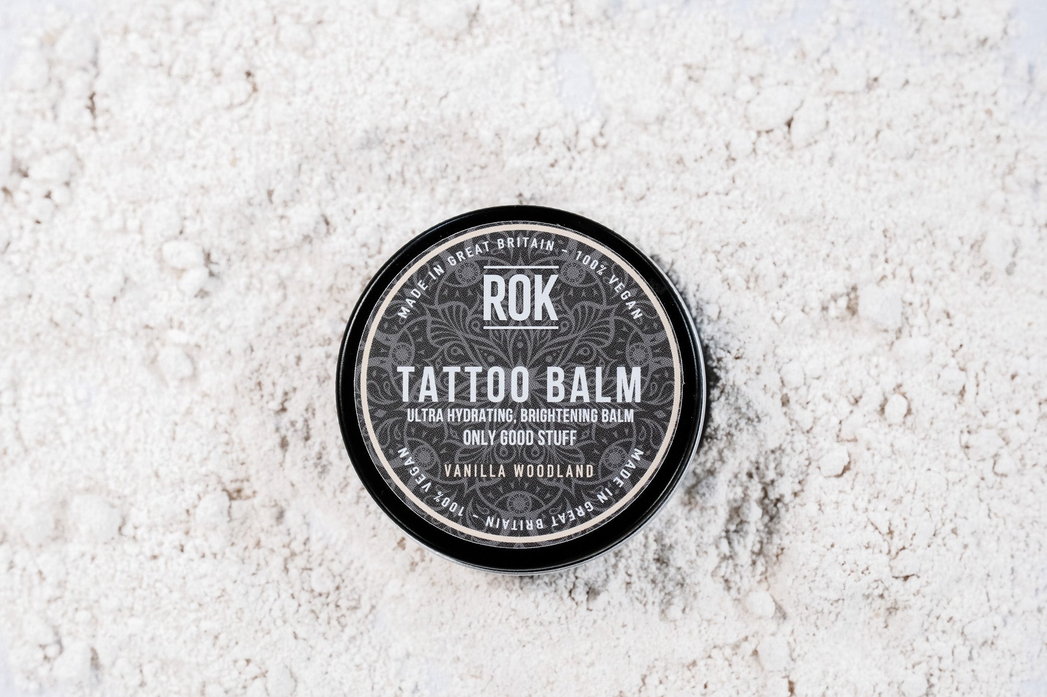 ROK Tattoo Balm black tin on light grey background – vegan brightening tattoo balm UK