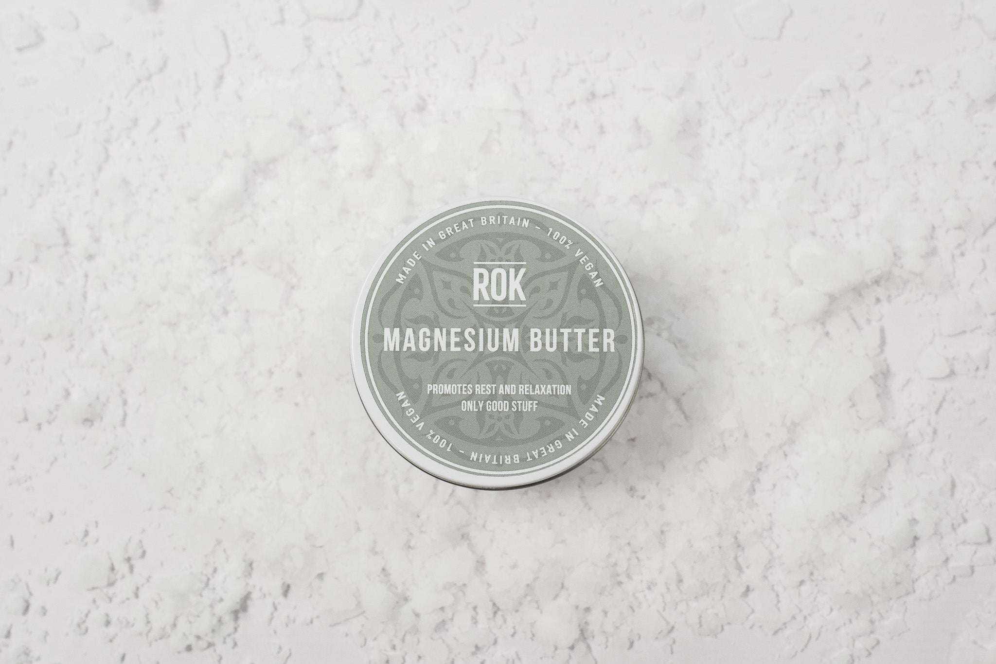 ROK Magnesium Butter tin on textured white surface – UK vegan body butter for relaxation