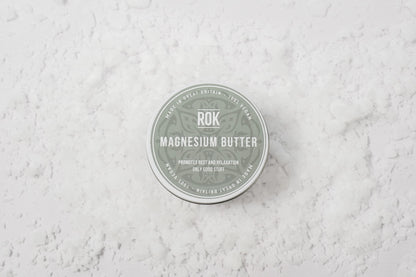 ROK Magnesium Butter tin on textured white surface – UK vegan body butter for relaxation