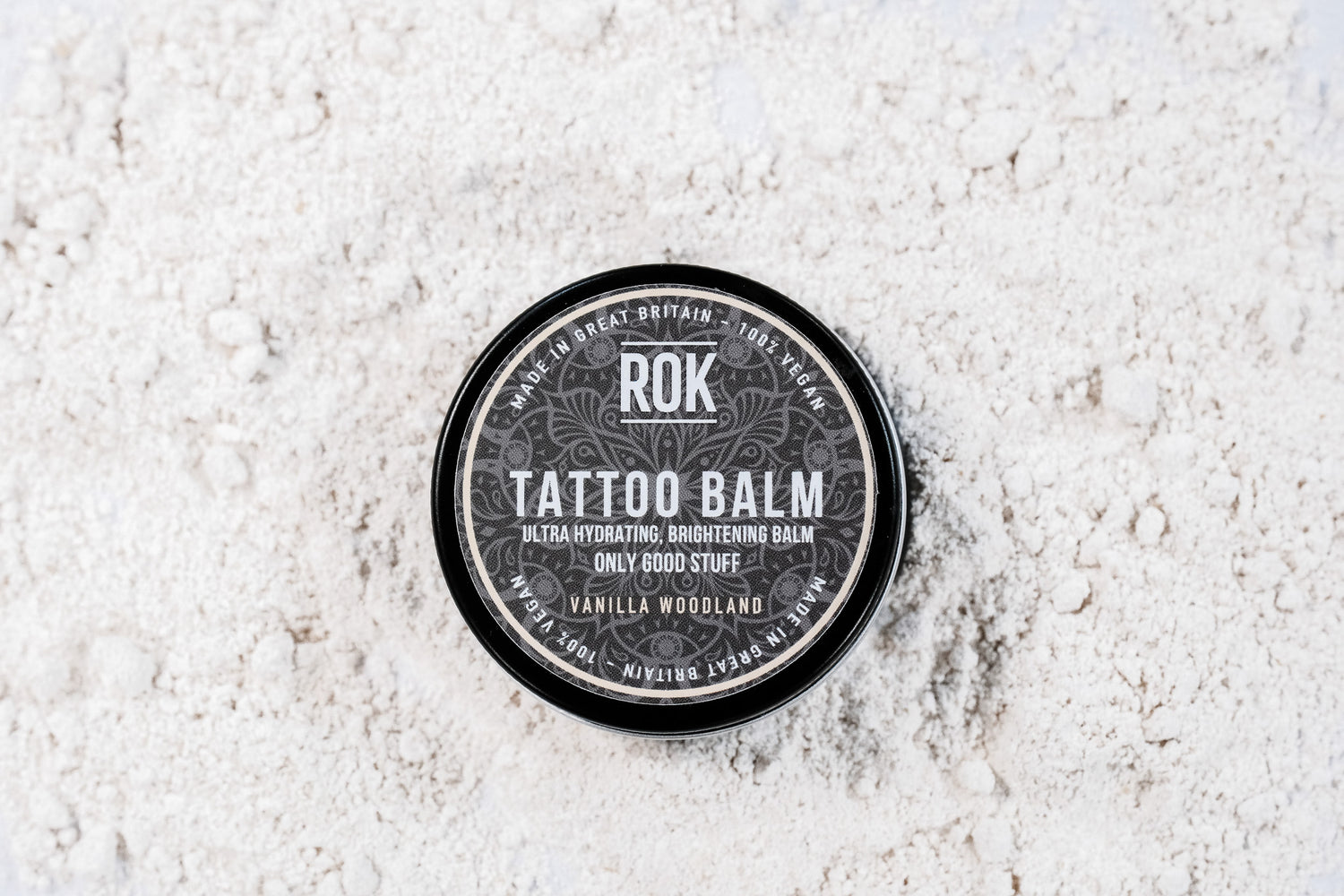 ROK Tattoo Balm black tin on light grey background – vegan brightening tattoo balm UK