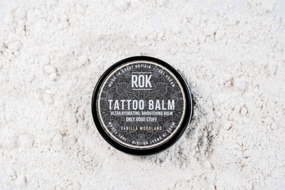 ROK Tattoo Balm black tin on light grey background – vegan brightening tattoo balm UK